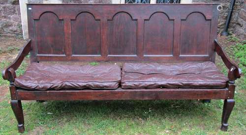 Georgian oak settle with arched and panelled back, shaped ar...