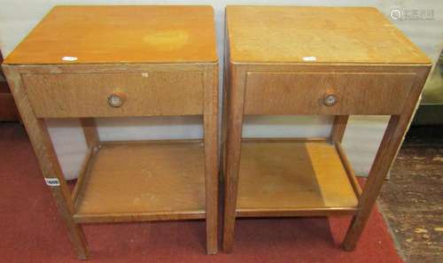 Pair of pale oak bedside tables, each enclosing a single dra...