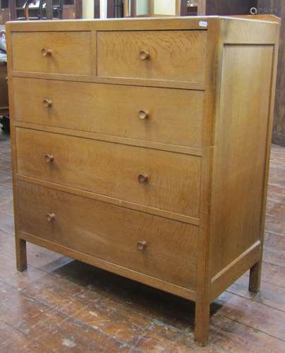 Pale oak chest of three long and two short drawers by Heals,...