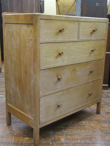 Pale oak chest of three long and two short drawers by Heals,...