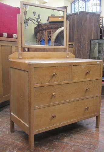 Pale oak dressing chest of two long and two short drawers, w...