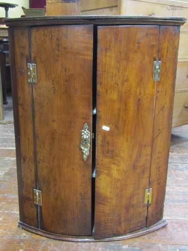 Georgian fruitwood hanging corner cupboard of bow fronted ou...