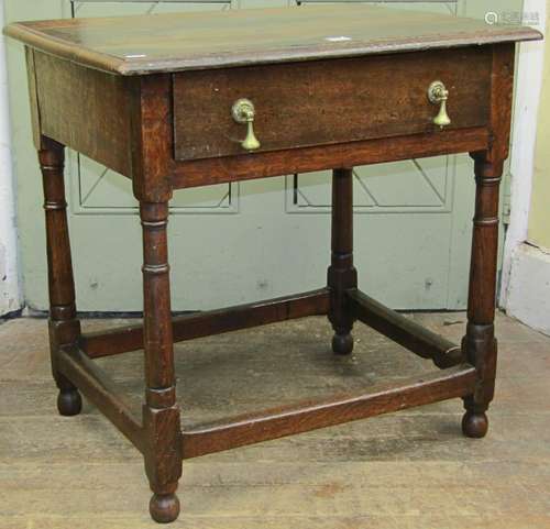 An Old English oak side table on four gun barrel supports, e...