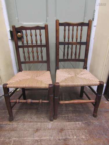 Six Georgian ashwood spindle back cottage chairs with rush s...