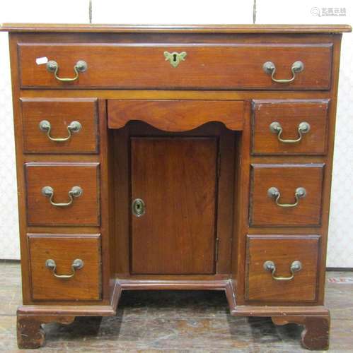 19th century mahogany kneehole writing desk, the central kne...