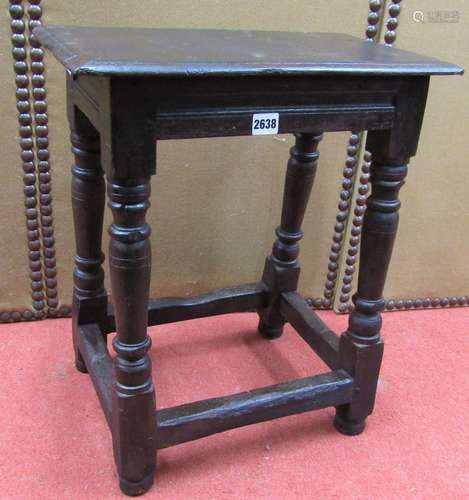 An Old English oak joint or coffin stool on turned supports