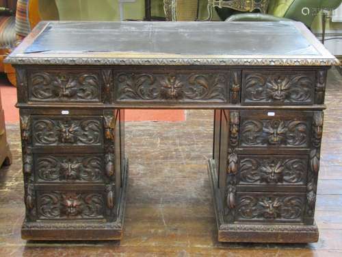 Victorian oak pedestal writing desk in the gothic revival ma...