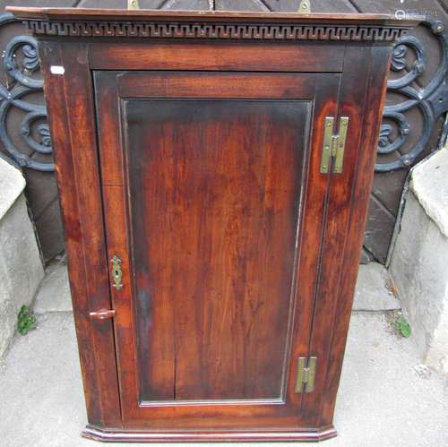 Georgian fruitwood hanging corner cupboard with panelled doo...