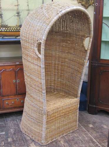 Wicker garden chair with hooded canopy and horseshoe shaped ...