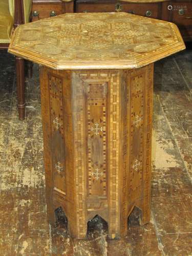 Moroccan occasional table, the octagonal top raised on a fur...