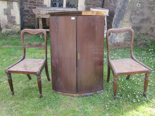 Pair of Regency rosewood dining chairs with cane panelled se...