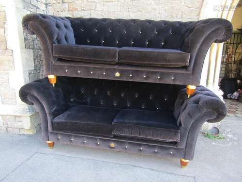 A graduated pair of Clive Christian Chesterfield sofas produ...