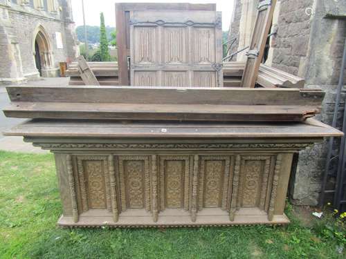 An antique carved oak vestibule fitted with three doors all ...