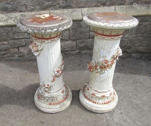 A pair of painted and distressed glass fibre columns with tr...