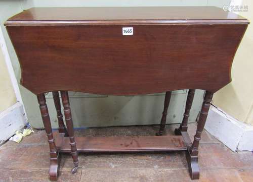 An Edwardian mahogany drop leaf table of narrow proportions,...