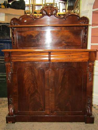 A slim Victorian mahogany chiffonier enclosed by a pair of p...