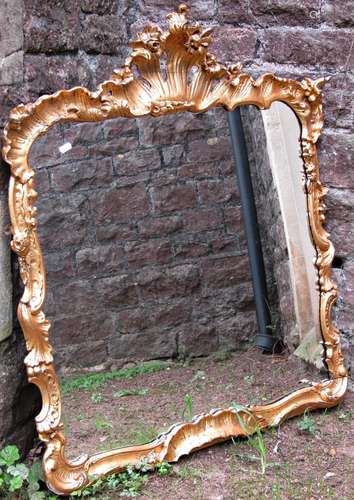 A Georgian gilded wall mirror with floral detail, the frame ...