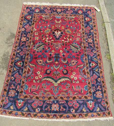 A Kashan carpet with overall floral red and blue pattern, 18...