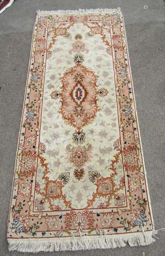 A Tabriz silk and wool rug of half a million knots, with a c...