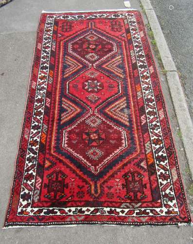 A Malayer mid 20th century carpet with two interlocking cent...