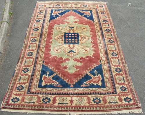 A Kazak carpet with good thick wool pile in with central med...