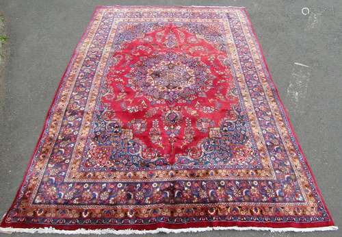 A good quality large Meshed carpet with central floral medal...