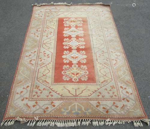 A Middle Eastern style carpet, with a central panel containi...