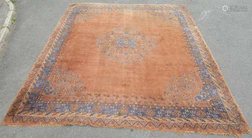 A large Qashgai carpet with a rusty red ground interspersed ...