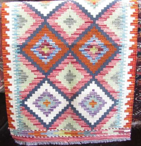 A Chobi kilim runner with stepped diamond lozenges 195cm x 6...