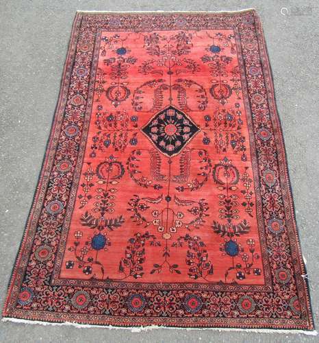 A very fine Persian rug with stylised floral designs on a ro...