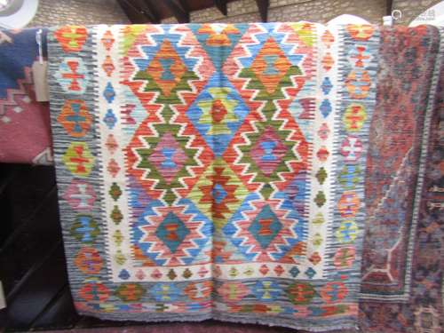 A Chobi kilim with a bright geometric diamond pattern, 163cm...