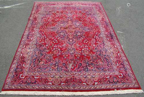 A good quality Meshed carpet with a large overall floral des...