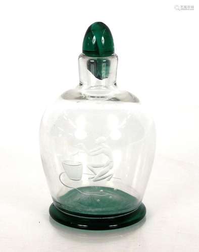 A green tinted glass bottle, with etched decoration of an Et...