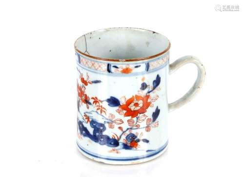 An 18th Century Chinese mug, under glazed blue and iron reds...