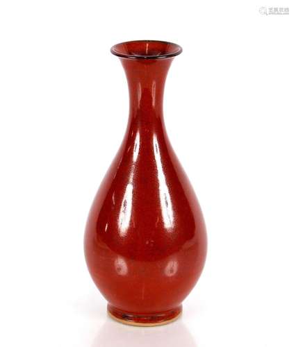 A Chinese Sang de Boeuf and speckled glazed vase, on slender...