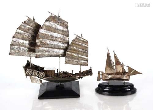 A small silver model of a Maltese sailing boat, with wooden ...