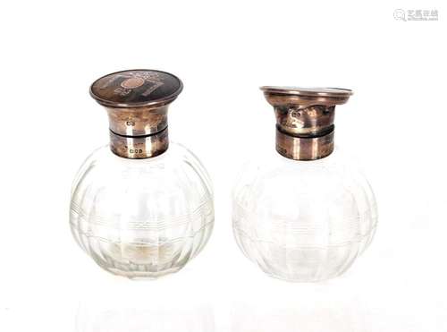 A pair of glass silver and tortoiseshell mounted scent bottl...