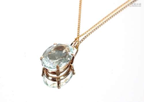 An 9ct gold aquamarine pendant, hung to a 9ct gold chain