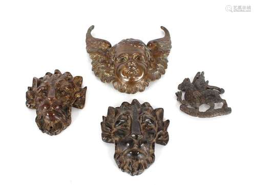 A 19th Century bronze cherub mask; two bronze lion mask appl...