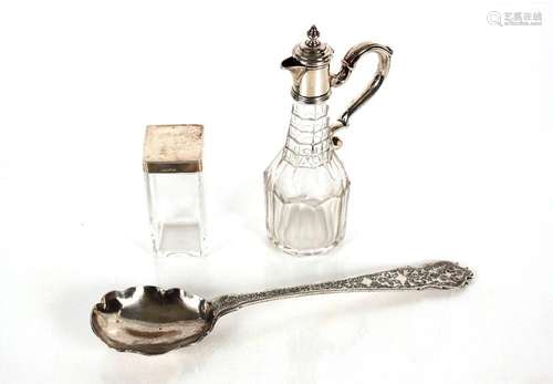 A Georgian glass and white metal mounted cruet bottle; a whi...