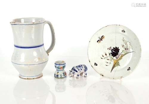 An 18th Century Delft blue and grey beer jug, a Delft floral...