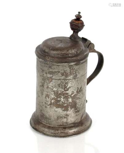 A George II English pewter flagon with wriggle work decorati...