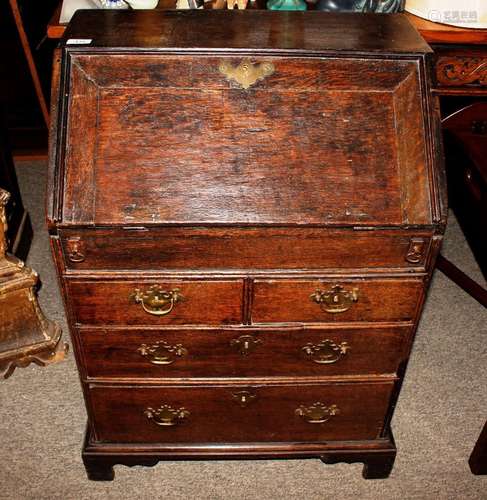 An 18th Century oak bureau, of small proportions, fitted bra...