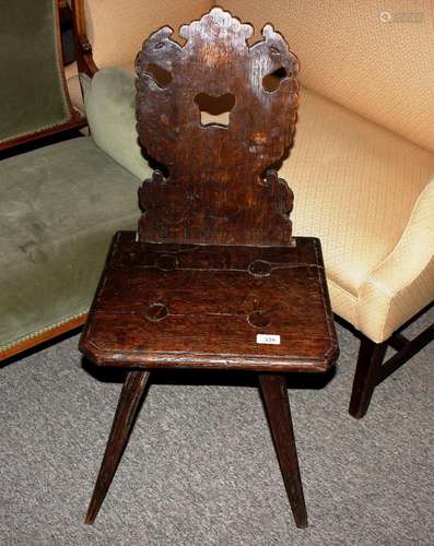 An 18th Century Bavarian carved hall chair, having beast car...