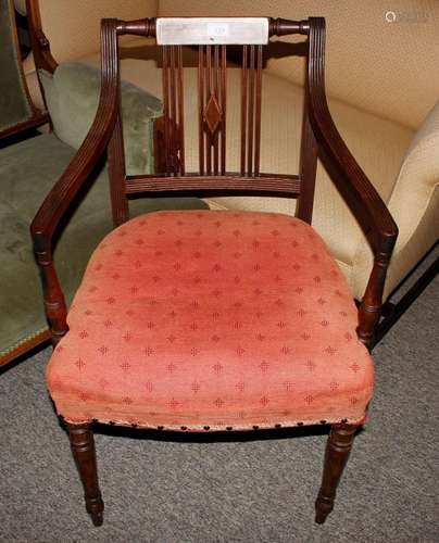 A 19th Century mahogany rail back elbow chair, with upholste...