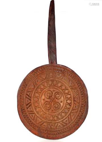 A South Seas carved wooden paddle, 88cm long, the head 45cm ...