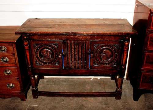 A Jacobean design carved oak buffet cupboard, of Titchmarsh ...