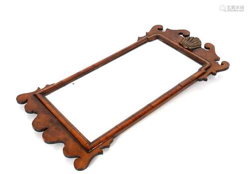 A walnut Chippendale design fret carved wall mirror, with gi...