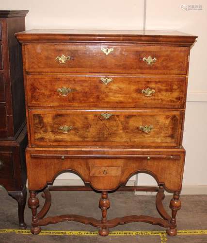 An 18th Century walnut three drawer chest, on stand, the sta...