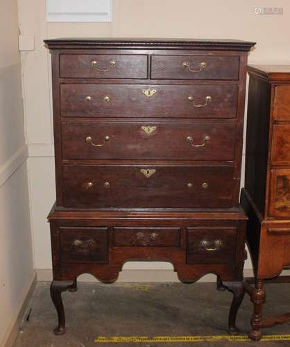 A Georgian oak chest on stand, the upper section fitted two ...